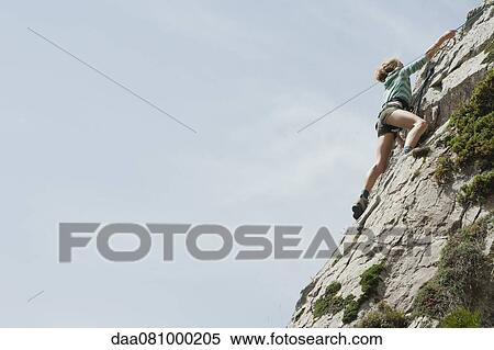 Preteen girl rock climbing View Large Photo Image Stock Photography - Preteen girl rock climbing. Fotosearch