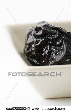 Prune in dish, extreme close-up View Large Photo Image Stock Image - Prune in dish, extreme close-up. Fotosearch