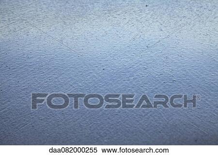 Stock Photography - Raindrops hitting surface of water, full frame. Fotosearch