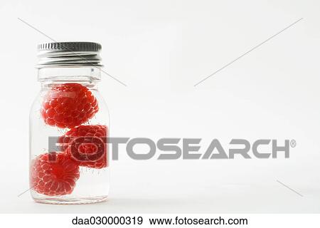 Raspberries in small jar View Large Photo Image Stock Photo - Raspberries in small jar. Fotosearch