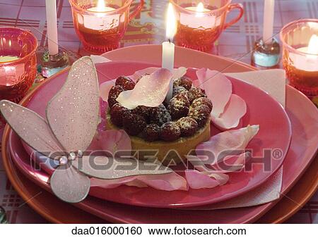 Raspberry pastry on plate decorated with rose petals and candles View Large Photo Image Stock Image - Raspberry pastry on plate decorated with rose petals and candles. Fotosearch