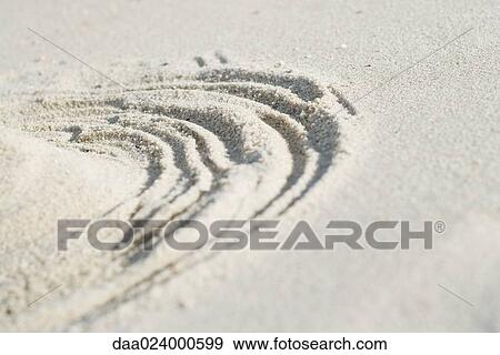 Rings drawn around pile of sand, cropped View Large Photo Image Stock Photo - Rings drawn around pile of sand, cropped. Fotosearch