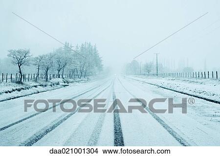 Road going through snowy landscape View Large Photo Image Picture - Road going through snowy landscape. Fotosearch