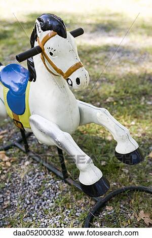 Rocking horse in park View Large Photo Image Stock Image - Rocking horse in park. Fotosearch