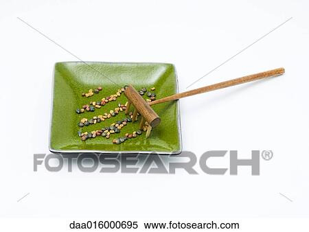 Rows of seeds in dish, with rake View Large Photo Image Stock Photography - Rows of seeds in dish, with rake. Fotosearch