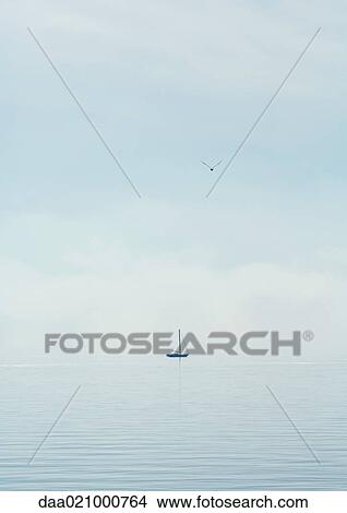 Sailboat on lake View Large Photo Image Picture - Sailboat on lake. Fotosearch