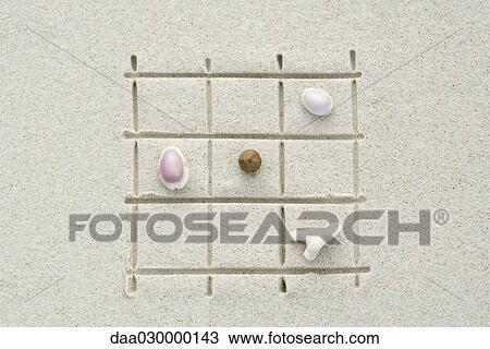 Seashells and coral arranged on grid drawn in sand, close-up View Large Photo Image Stock Image - Seashells and coral arranged on grid drawn in sand, close-up. Fotosearch