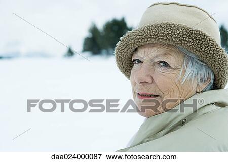 Senior woman in snowy landscape, head and shoulders View Large Photo Image Stock Photo - Senior woman in snowy landscape, head and shoulders. Fotosearch