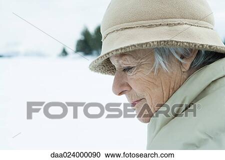 Senior woman in snowy landscape, looking down, head and shoulders View Large Photo Image Stock Image - Senior woman in snowy landscape, looking down, head and shoulders. Fotosearch