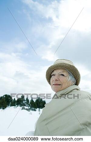 Senior woman in snowy landscape, waist up View Large Photo Image Stock Photo - Senior woman in snowy landscape, waist up. Fotosearch