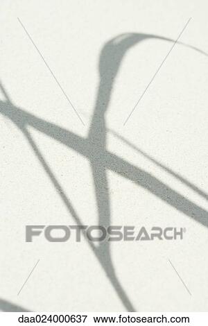 Shadow of plant on sand, close-up View Large Photo Image Stock Photo - Shadow of plant on sand, close-up. Fotosearch