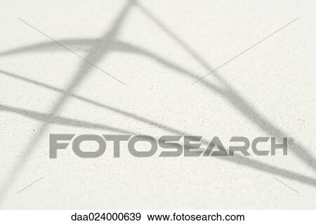 Shadow of plant on sand, close-up View Large Photo Image Stock Photo - Shadow of plant on sand, close-up. Fotosearch