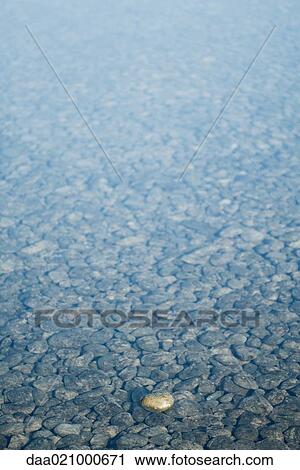 Shallow water over pebbles View Large Photo Image Stock Image - Shallow water over pebbles. Fotosearch