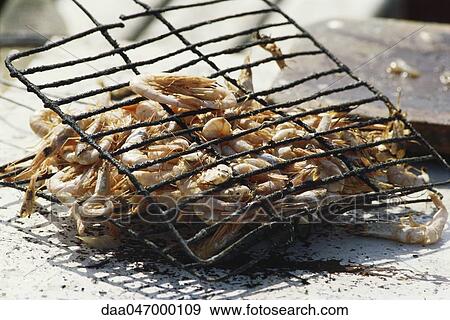 Shrimp being grilled in grid iron View Large Photo Image Stock Photo - Shrimp being grilled in grid iron. Fotosearch