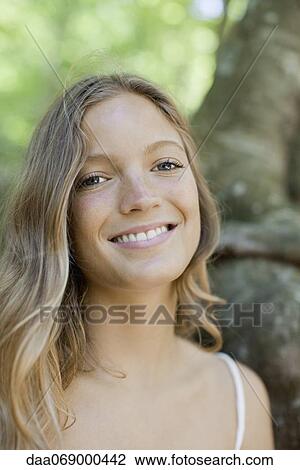 Smiling young woman, portrait View Large Photo Image Stock Image - Smiling young woman, portrait. Fotosearch