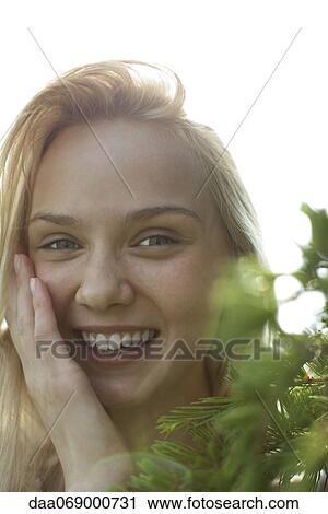 Smiling young woman, portrait View Large Photo Image Stock Image - Smiling young woman, portrait. Fotosearch