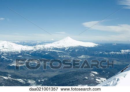 Stock Photo - Snow-capped mountainous landscape. Fotosearch