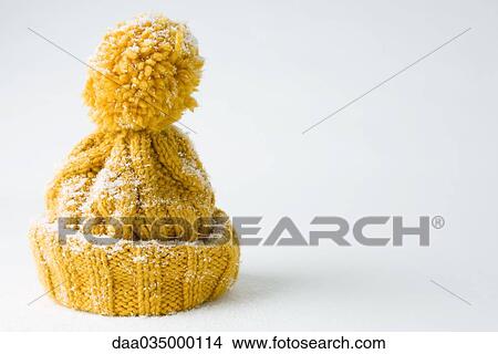 Picture - Snow-covered knit hat. Fotosearch