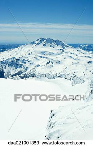 Stock Image - Snow-covered mountainous landscape. Fotosearch