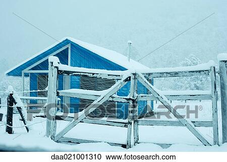 Stock Image - Snowy landscape with chalet. Fotosearch