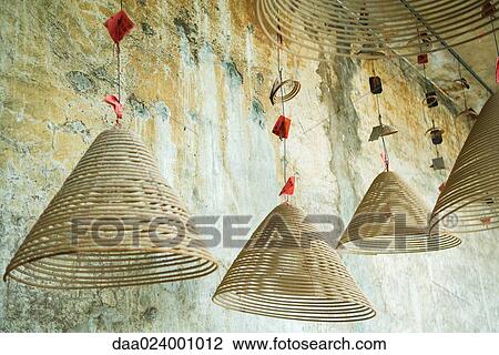Spirals of incense hanging from ceiling View Large Photo Image Stock Image - Spirals of incense hanging from ceiling. Fotosearch