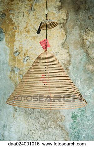 Spirals of incense hanging from ceiling View Large Photo Image Stock Photograph - Spirals of incense hanging from ceiling. Fotosearch