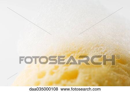 Sponge covered in soap suds, close-up View Large Photo Image Stock Photo - Sponge covered in soap suds, close-up. Fotosearch