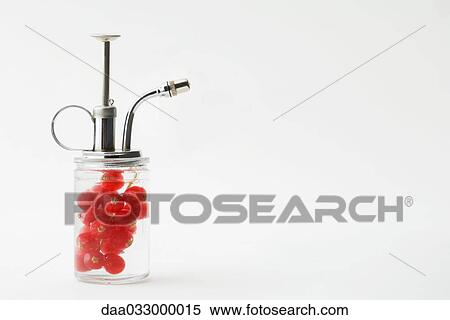 Spray bottle with red currants inside View Large Photo Image Stock Photography - Spray bottle with red currants inside. Fotosearch