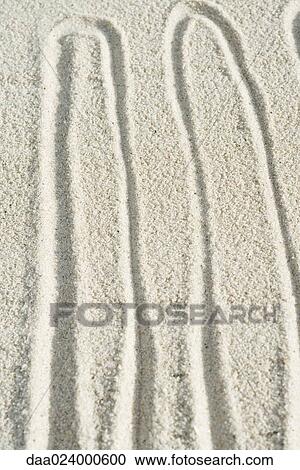 Squiggly pattern drawn in sand View Large Photo Image Stock Image - Squiggly pattern drawn in sand. Fotosearch