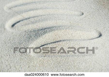 Squiggly pattern drawn in sand View Large Photo Image Stock Image - Squiggly pattern drawn in sand. Fotosearch