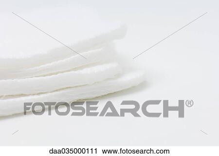 Stock Image - Stack of cotton pads, close-up. Fotosearch