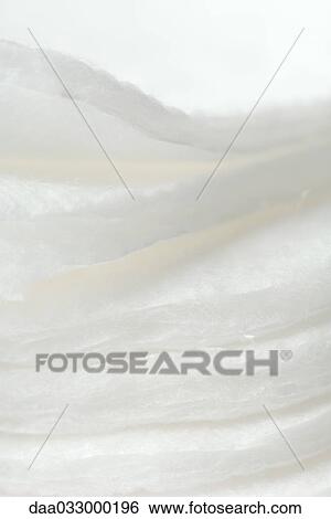 Stacked cotton cosmetic pads, extreme close-up View Large Photo Image Stock Photograph - Stacked cotton cosmetic pads, extreme close-up. Fotosearch