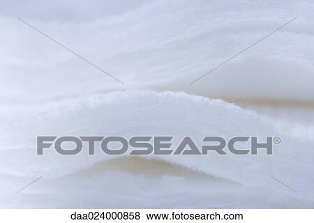Stock Photo - Stacked cotton pads, extreme close-up. Fotosearch