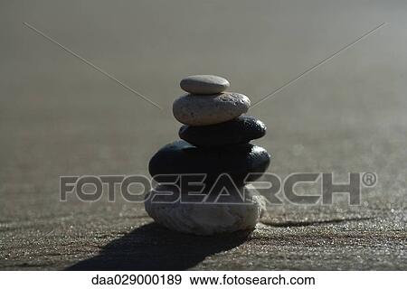 Stacked pebbles, close-up View Large Photo Image Stock Photo - Stacked pebbles, close-up. Fotosearch