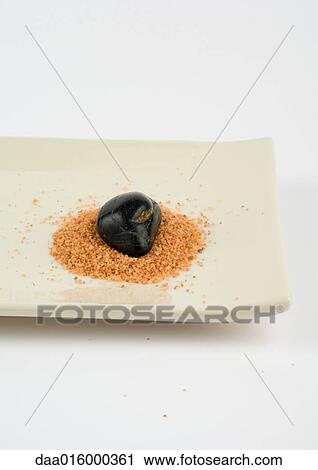 Stock Image - Stone and bath salts on dish. Fotosearch