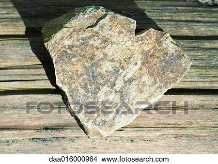 Stone on wood View Large Photo Image Picture - Stone on wood. Fotosearch