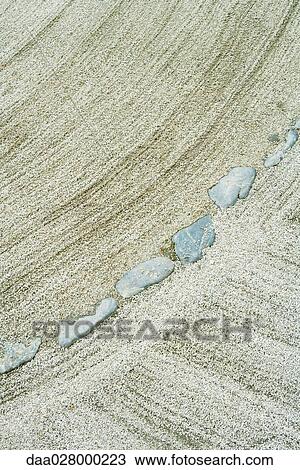 Stock Image - Stones and gravel in rock garden, high angle view. Fotosearch