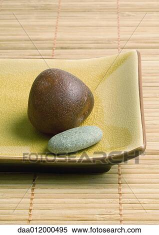 Stones on rectangular dish View Large Photo Image Stock Photography - Stones on rectangular dish. Fotosearch