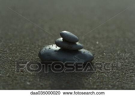 Stock Image - Stones stacked on top of each other, close-up. Fotosearch