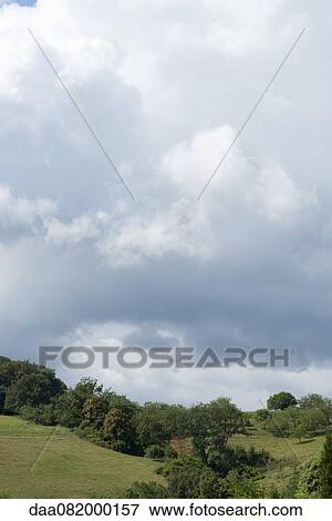 Stock Photo - Storm clouds over countryside. Fotosearch