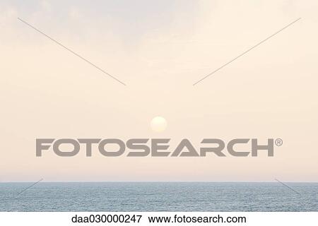 Sun rising over seascape View Large Photo Image Stock Photo - Sun rising over seascape. Fotosearch