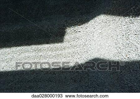 Sunlight and shadow on gravel, close-up View Large Photo Image Stock Image - Sunlight and shadow on gravel, close-up. Fotosearch