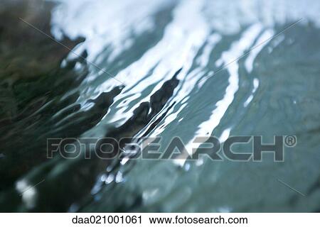 Stock Image - Surface of water, extreme close-up. Fotosearch