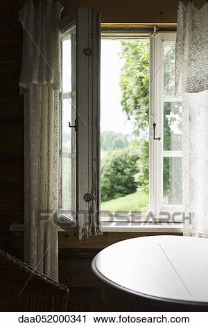 Table by open window View Large Photo Image Stock Image - Table by open window. Fotosearch