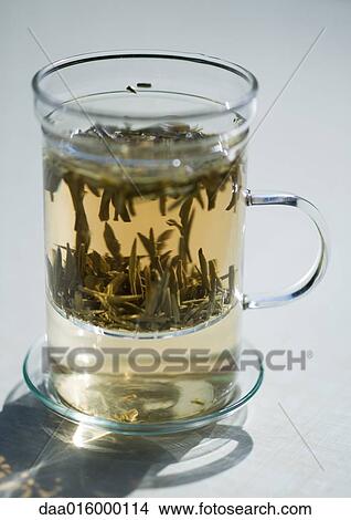 Tea steeping in mug with tea strainer View Large Photo Image Picture - Tea steeping in mug with tea strainer. Fotosearch