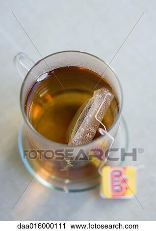 Stock Image - Teabag steeping in mug. Fotosearch