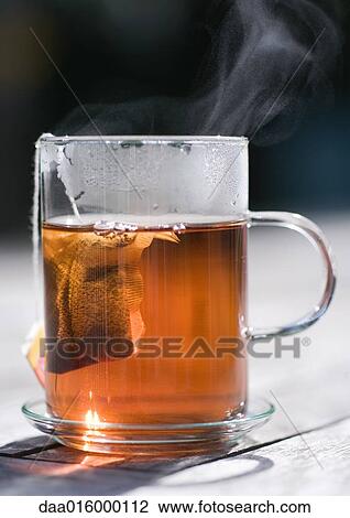 Stock Image - Teabag steeping in mug. Fotosearch