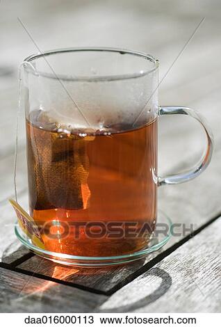 Stock Image - Teabag steeping in mug. Fotosearch