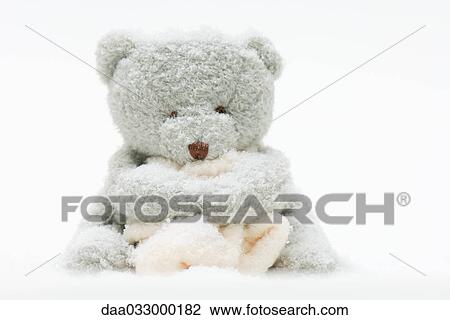 Teddy bear holding blanket, covered in imitation snow View Large Photo Image Stock Image - Teddy bear holding blanket, covered in imitation snow. Fotosearch