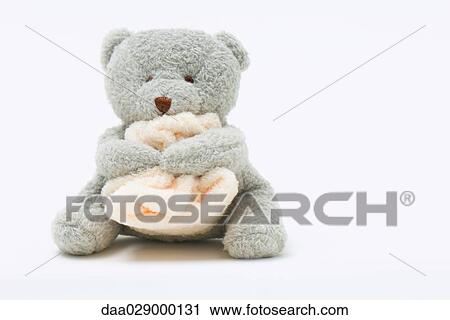 Teddy bear holding blanket View Large Photo Image Stock Image - Teddy bear holding blanket. Fotosearch